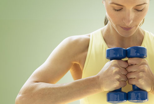 photo of woman with hand weights