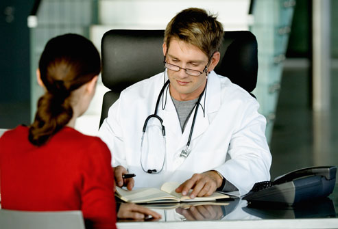 woman at doctors desk